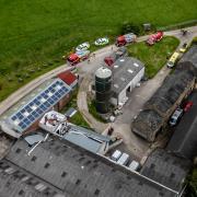 The damaged brewery and emergency service vehicles in Workington