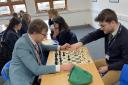Holden Davies (right) is encouraging more students to feel benefits of playing chess