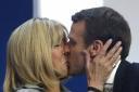Passionate: French centrist presidential candidate Emmanuel Macron kisses his wife Brigitte
