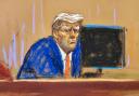 In this courtroom sketch, former US president Donald Trump turns to face the audience at the beginning of his trial over charges that he falsified business records to conceal money paid to silence porn star Stormy Daniels in 2016, in Manhattan state