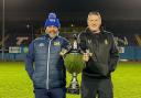 Workington Town head coach Anthony Murray and Whitehaven head coach Jonty Gorley holding the Ike Southward Memorial Trophy
