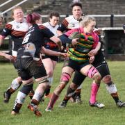 n The Finches pile in to stop a charge from Littleborough Pink Warriors