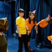 The young actors rehearse for their show