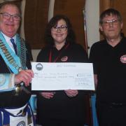 Freemasons present the cheque to Blood Bikes Cumbria