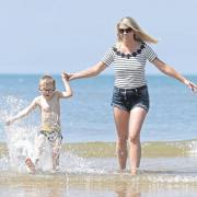 Samantha Bramwell and her son Harry play in the sea Blackpool beach, as Britons could see the hottest day of the year this Bank Holiday Monday. PRESS ASSOCIATION Photo. Picture date: Monday May 28, 2018. See PA story WEATHER BankHoliday. Photo credit