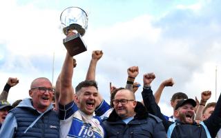 Matty Henson lifts the Ike Southward Trophy for Workington Town after their derby clash with Whitehaven	             Ben Challis Sport Photography