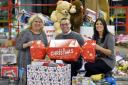 The Cash For Kids Christmas Toy Appeal distribution centre. Thousands of toys from the drop of points have been brought to the Arco Warehouse in Kingstown Carlisle to be sorted and despatched to children across Cumbria. Sara Oldham (left) and Katie Jones 