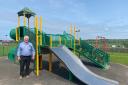 Parish councillor Peter Gaston next to some of the new play equipment.