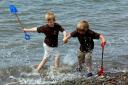 allonby summer weather4            20070601Seaton brothers Kai Roach, aged 7, and Jay, aged3, having a splashing time enjoying the warm June weather at Allonby beach.PIC MARK JOHNSTON.