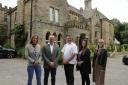 The team from Osprey Management Group outside of Hunday Manor