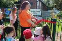 Mayor Beth Dixon cuts the ribbon for the new garden