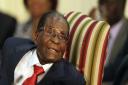 Guests at town's festival include the man Robert Mugabe called a spy