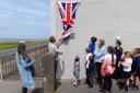 Scott Little unveils the new plaque in Allonby