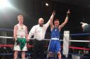 Victory: Carlisle Villa ABC man Mikey Burgess, right, has his arm raised aloft as he gets the better of Gregg Brady at Friday night’s Furness Catholic ABC dinner show