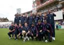 Winners: England’s cricketers celebrating at the Kia Oval yesterday with the World Cup
