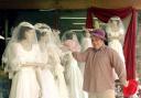 Best man Dave Richards with his Spring Collection of wedding dresses at Age Conern's Charity Shop Workington. pic Jim davis