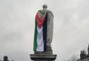 The Palestinian flag which was placed on the town's Mayo statue