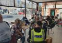Police officers meet with residents