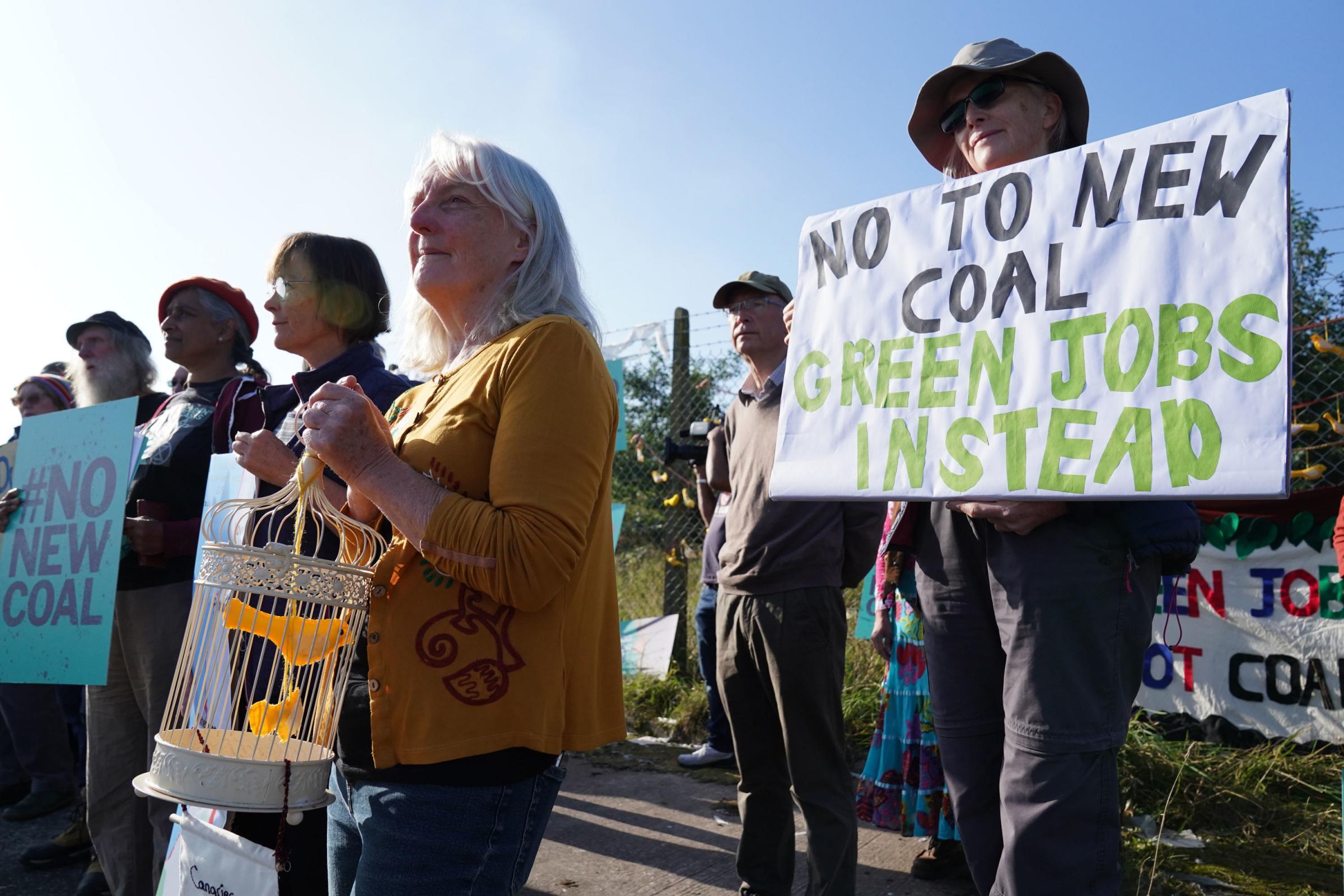 CONTROVERSY: Protesters gather outside the site of the proposed coal mine in Whitehaven in September, Pic: Owen Humphreys/PA