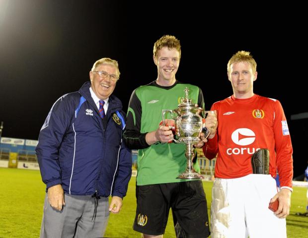 Times and Star: Adam Collin, centre, with Workington captain Tony Hopper, right, after winning the Cumberland Cup in 2009 (photo: Stuart Walker)