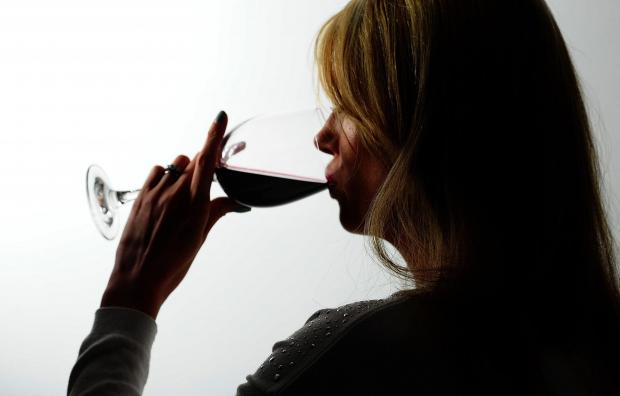 Times and Star: A woman drinking red wine. Credit: PA