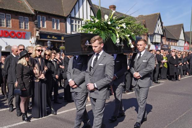 Times and Star: The coffin of The Wanted star Tom Parker is carried ahead of his funeral. (PA)