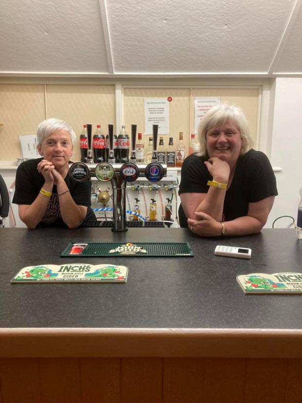 Times and Star: SMILE: Two bar volunteers on the day