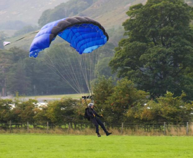 Times and Star: A-LIST: Tom Cruise skydiving across Buttermere Lake. 
