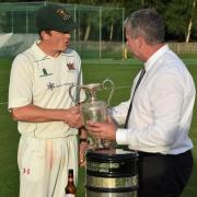 It’s yours: Cumbria Cricket League chairman Steve Chambers presents Carlisle Cricket Club captain Marc Brown with the Premier Division trophy (Photo: Ben Challis)