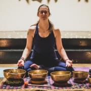 Simone Walters a holistic therapist from Workington (43) in the lotus meditative position surrounded by Tibetan sound bowls