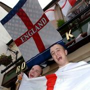 royal oak england flags1             20040609...Workington Royal Oak landlords Alan Lockie,left, and Darren Ellwood, prepared for the forthcoming festival of football Euro 2004...PIC MARK JOHNSTON.              Copy Matthew...
