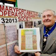 President of the Maryport Amature Operatic & Dramatic Society John Slater beside the display in Maryport Library celebrating the groups centenary.
Pic Tom Kay     4th March 2013 50045249T001.JPG
