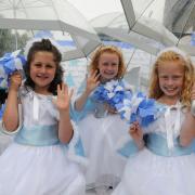 It is just pretend snow for these three little cuties, Cockermouth carnival Snow Queen, cemtre, Jessica Wilson 8, left Daisy Thomas 8 and Georgina Wilson