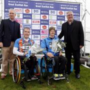06/10/13..
GLASGOW GREEN.
Bank of Scotland Great Scottish Run Simon Lawson

Maryport wheelchair racer Simon Lawson, second from right, on the podium after winning the Great Scottish Run in Glasgow on Sunday. Picture: Jeff Holmes.