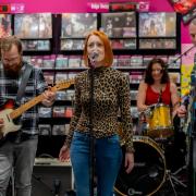 A band performing in store