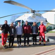 GNAAS paramedic Lee Salmon and Dr Lyle Moncur with Ian Wood and his family