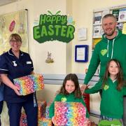 Greg Johnston with his daughters and children's ward sister Julie Graham