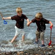 allonby summer weather4            20070601Seaton brothers Kai Roach, aged 7, and Jay, aged3, having a splashing time enjoying the warm June weather at Allonby beach.PIC MARK JOHNSTON.