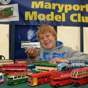 Cockermouth Show. 4 Aug 2012. Pics Jim Davis.

Maryport Model Club, Brad Paisley aged 13, from Maryport, with his collection of buses. 50036996T028.jpg