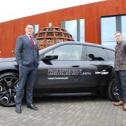 The BMW iX xDrive50 M-Sport is decorated with Lakes College branding