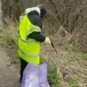 The youth picks up litter