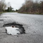 It is not advised to begin filling in potholes yourself