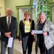 Elaine Thompson from Cumbria Cerebral Palsy and David Bertram from the European Prize Scholarship with former Mayor Julie Laidlow (centre)